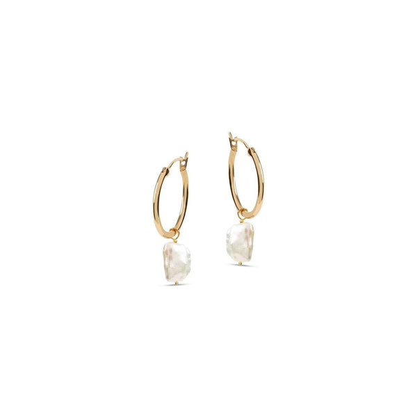 The sustainable star of any stack: stunning vintage keshi pearls with recycled gold hoops.