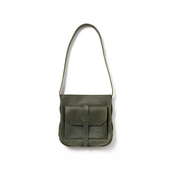 A green crossbody bag handcrafted from sustainable leather that makes a faithful companion for your everyday pursuits.