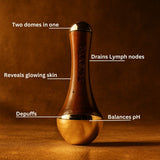Skincare tool with labeled benefits on a brown background