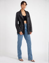 Woman wearing Deadstock Leather Blazer #color_black