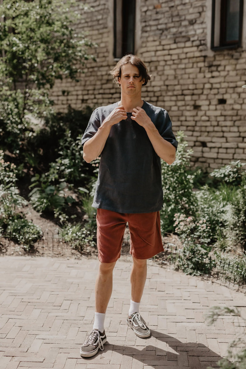 Man Wearing Black Linen T-Shirt And Terracotta Linen Shorts