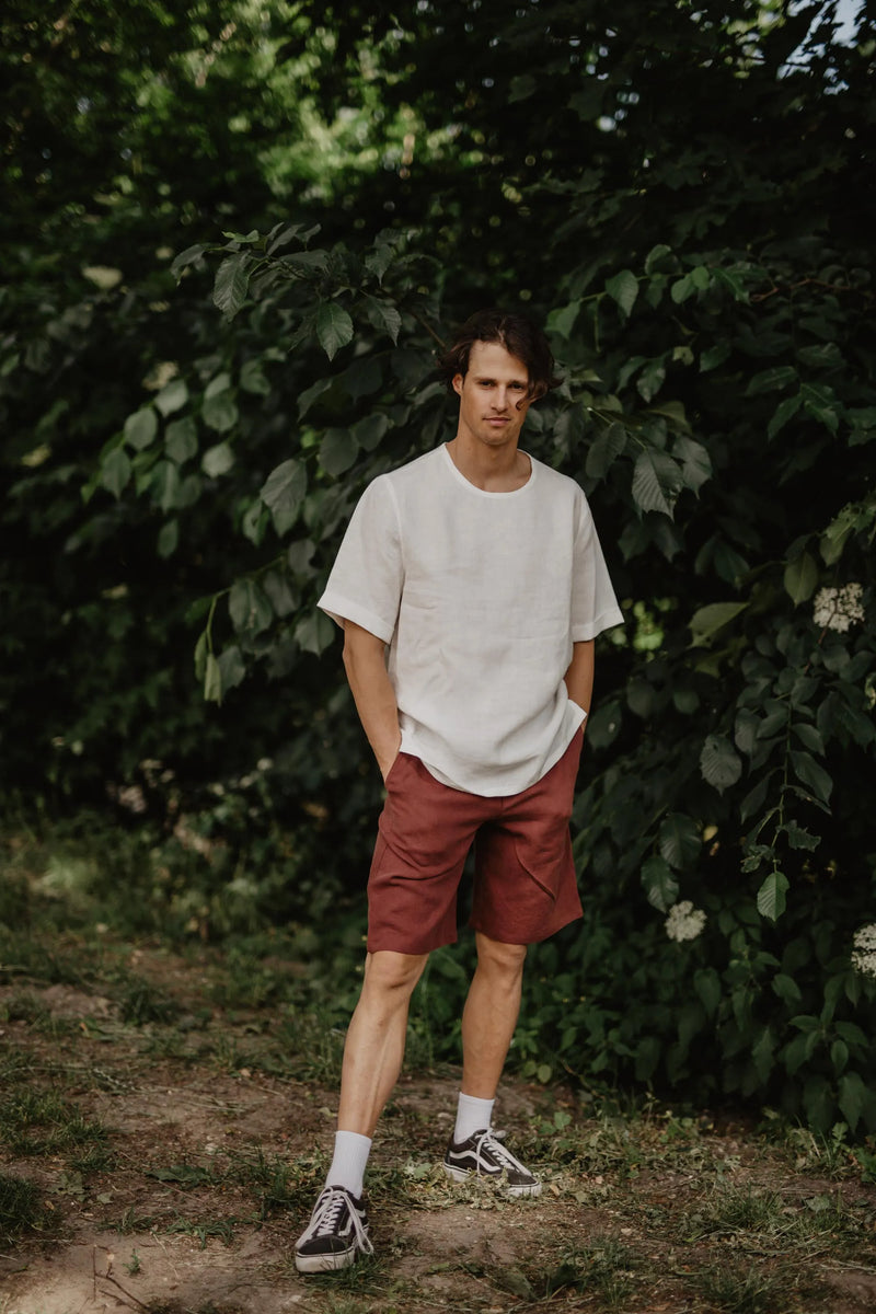 Mna Facing Forward Wearing Terracotta Color Linen Shorts And White T Shirt