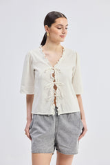Relaxed Fit Top With Ruffles and Front-Ties in Cream
