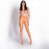 Woman wearing sheer beige bodysuit on a white background