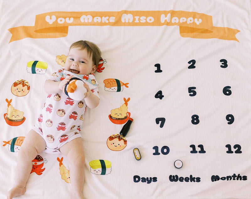 the wee bean cute baby on milestone growth tracker blanket