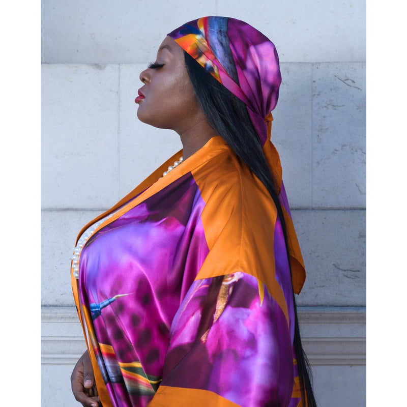Silk scarf with Orange Bird of Paradise and Pink and Purple print styled as a headscarf, paired with a Pink and Purple Luxury Silk Kimono.