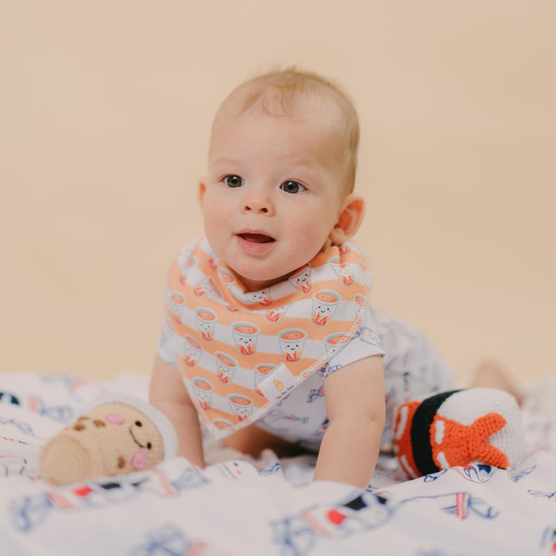 cute baby tummy time in milk tea bib