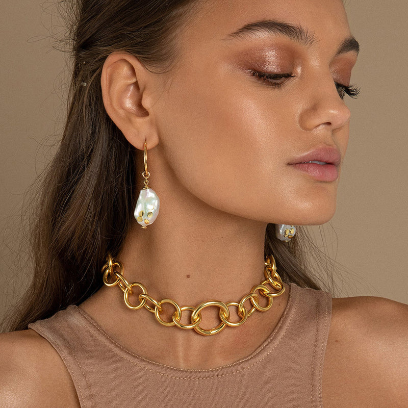 The Daphne Thick Gold Chain Choker is a vintage inspired, oversized, hand assembled necklace with round link details and option to add a charm or pendant to the lock.