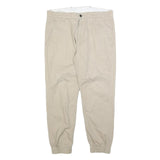 LEVI'S Mens Cotton Blend Beige Slim Tapered Trousers W34 L26 Elasticated Hem