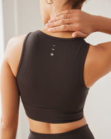 Model wearing the L’Original bra in Java brown color, made from OEKO-TEX® certified compression fabric with Elastique’s MicroPerle® technology to enhance circulation, support lymphatic drainage, and provide pain relief.