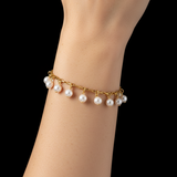 Woman with Asian skin tone wearing White Pearl Charm Bracelet