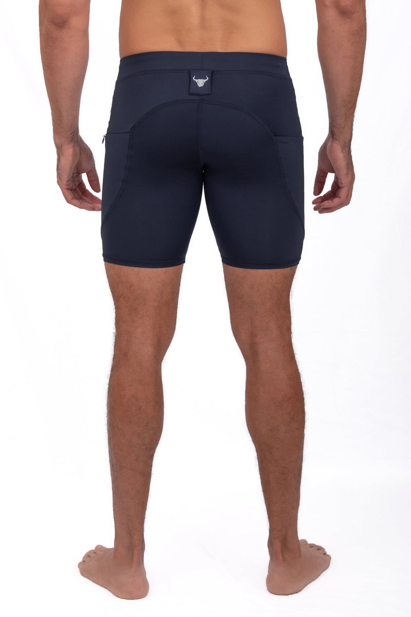backside of solid color navy legging shorts for guys
