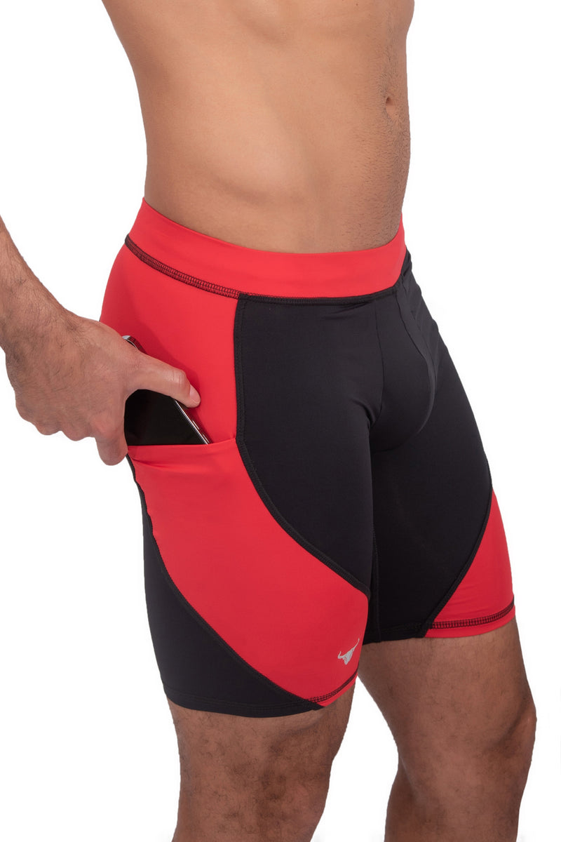 side view of black and red short tights with phone pocket