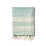 A traditional and timeless blue towel woven by hand from 100% Ethiopian cotton, dyed in small batches, and fringed by hand.