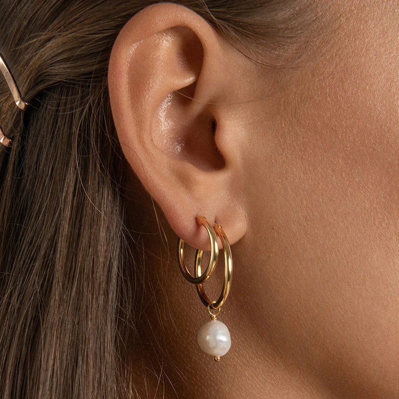 The perfect everyday gold hoop earrings entirely handmade with sustainable materials