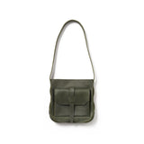 A green crossbody bag handcrafted from sustainable leather that makes a faithful companion for your everyday pursuits.