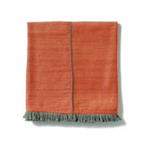 A beautifully made red throw hand-spun from Ethiopian silk and cotton.