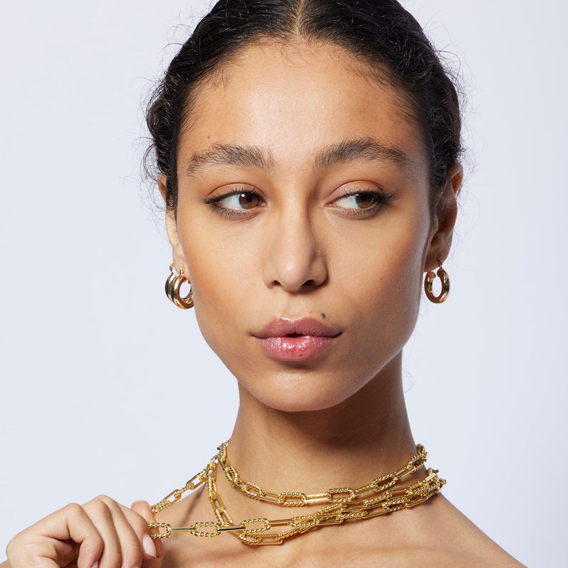 The Lilly Twisted Cable Link Gold Chain Necklace is handmade of brass (one the most recycled metals in the world) and 14 Carat Fair Trade gold.