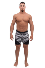male model wearing gray and black camo half-length compression tights
