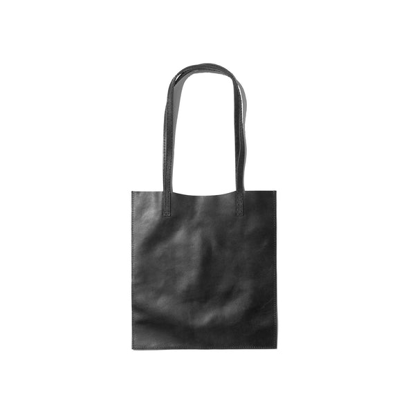 A black tote bag, understated yet sleek, handcrafted from sustainable leather.