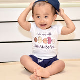 cute toddler baby in the wee bean organic cotton onesie in we are all human beans anti-hate anti-violence