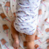 cute baby crawling and wearing the wee bean organic cotton onesie romper bodysuit in white rabbit candy