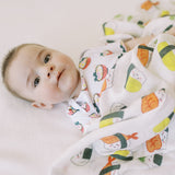 cute newborn baby with the wee bean organic cotton swaddle in sushi