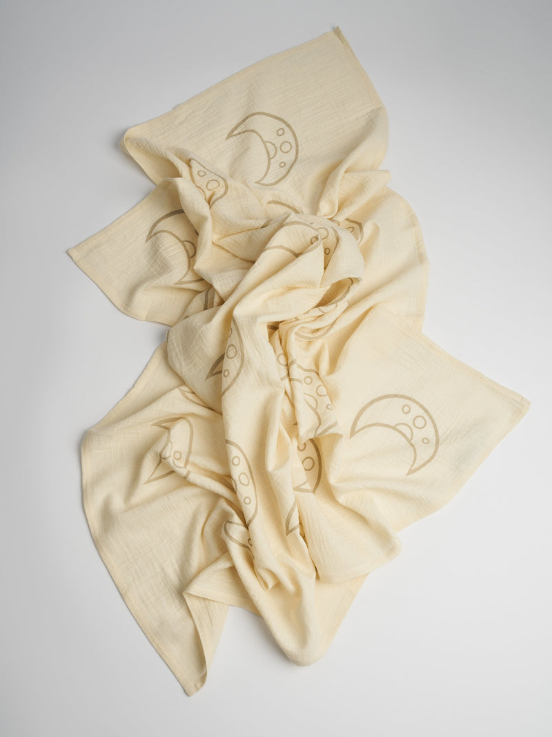 Organic and Fairtrade Cotton Muslin Swaddle in Natural with Moons#color_natural-moons
